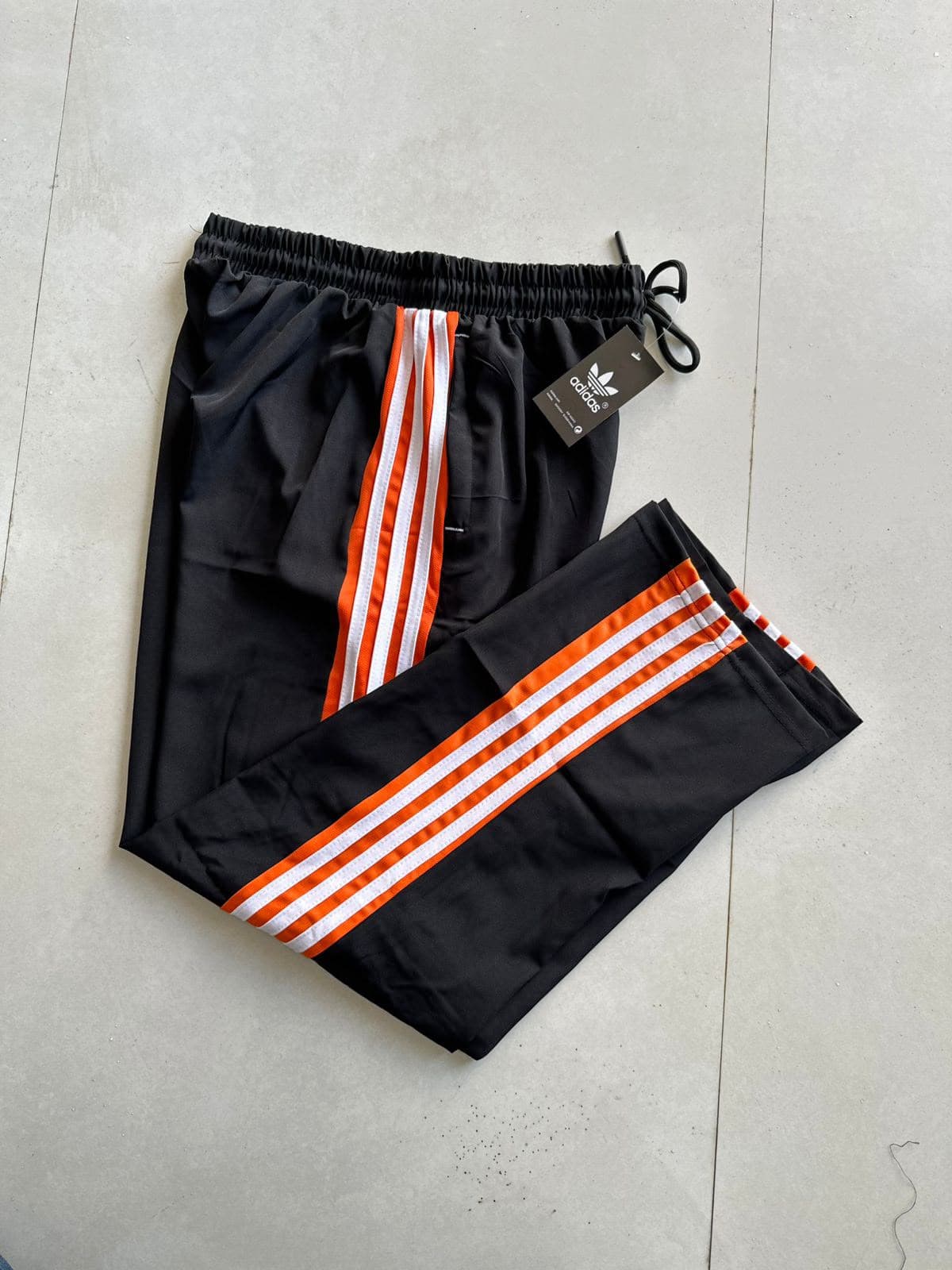 Black Orange Stripe Track Pants — track pants available at 2ND EXIT, Palakkad